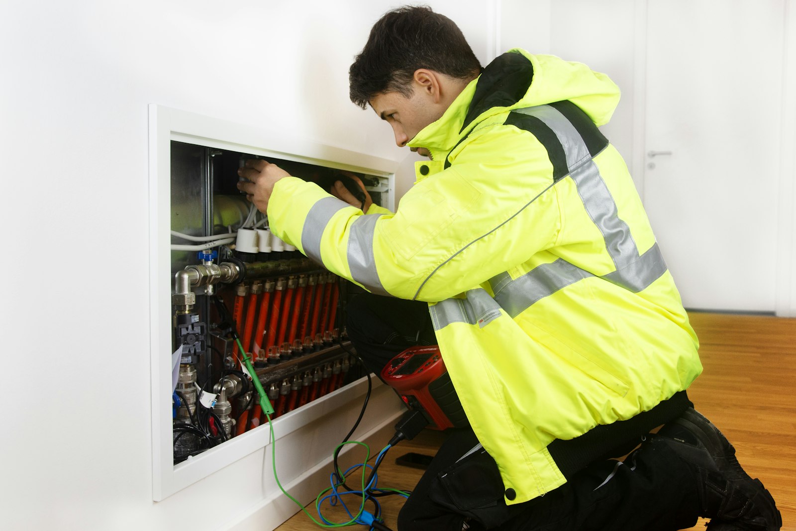 Electrician installing electrical equipment